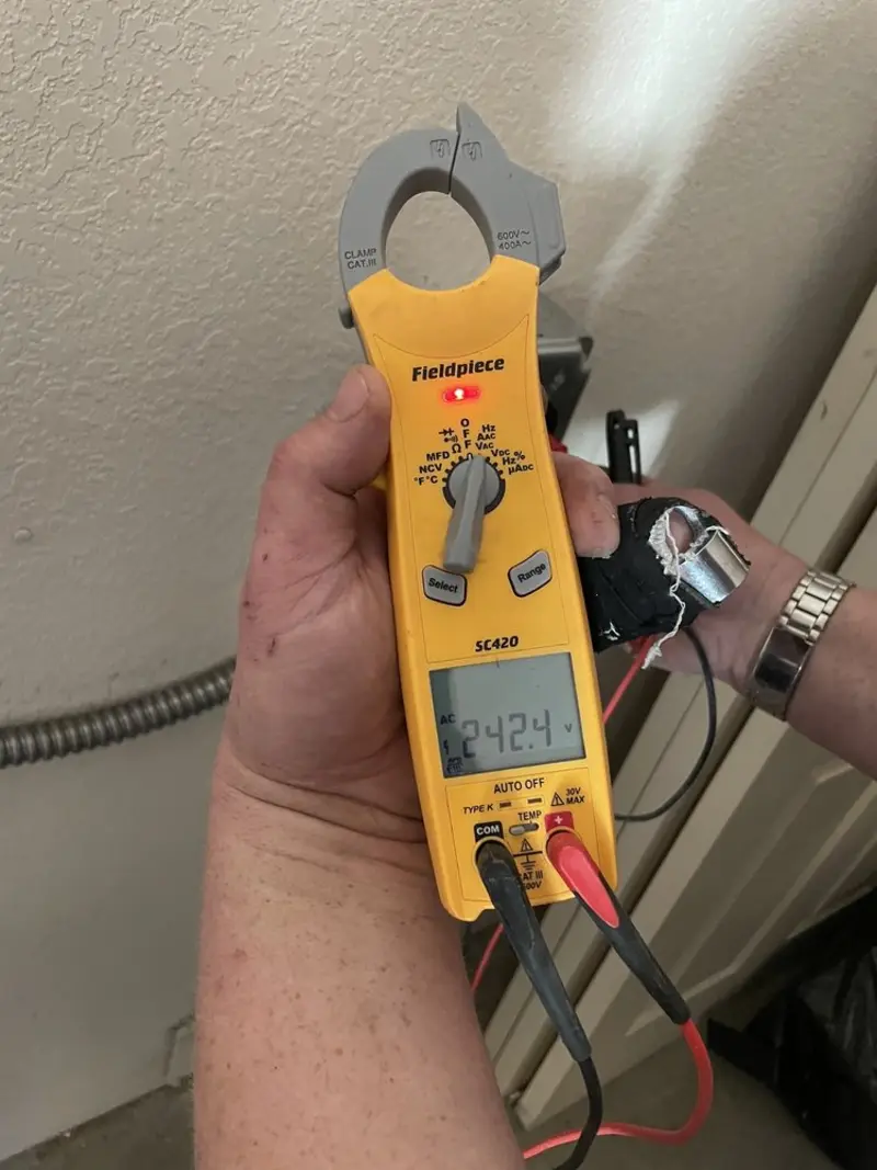 Voltage testing with clamp meter during Electrical Installation Services in Dover-Foxcroft